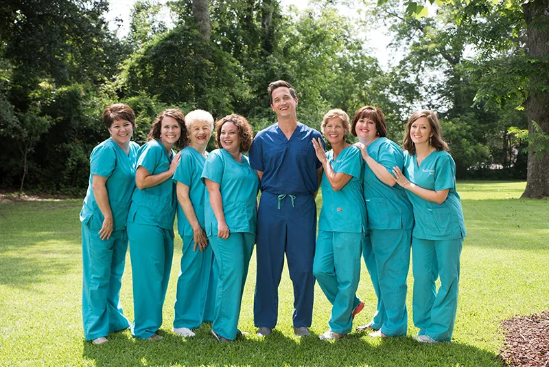 Dental team at Belk Ditcharo Dental posing outside