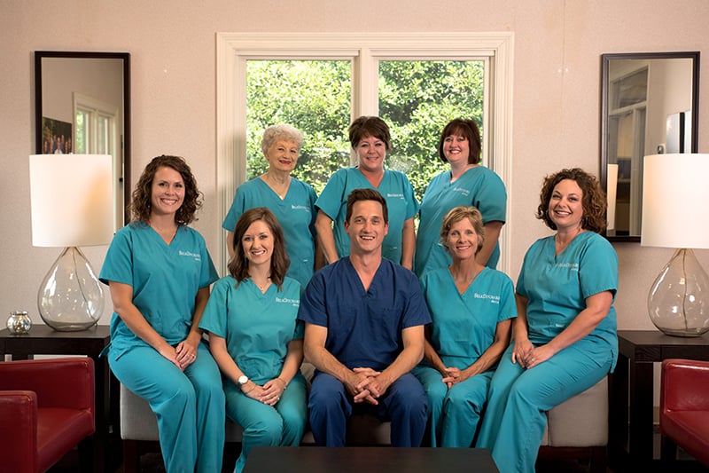 Dental team at Belk Ditcharo Dental posing in the office