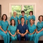 Dental team at Belk Ditcharo Dental posing in the office